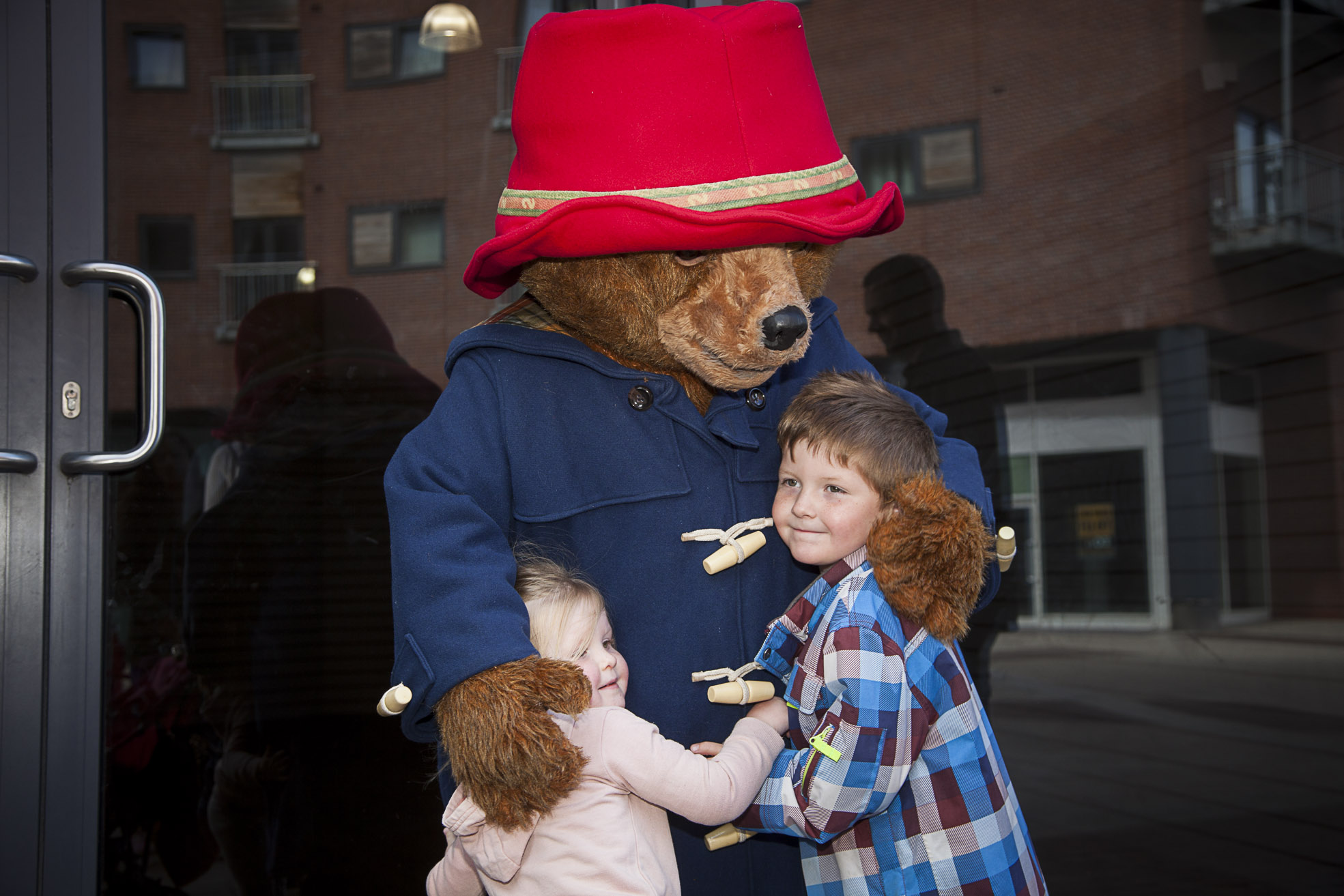 Excited young fans queue to see their furry hero Paddington Bear