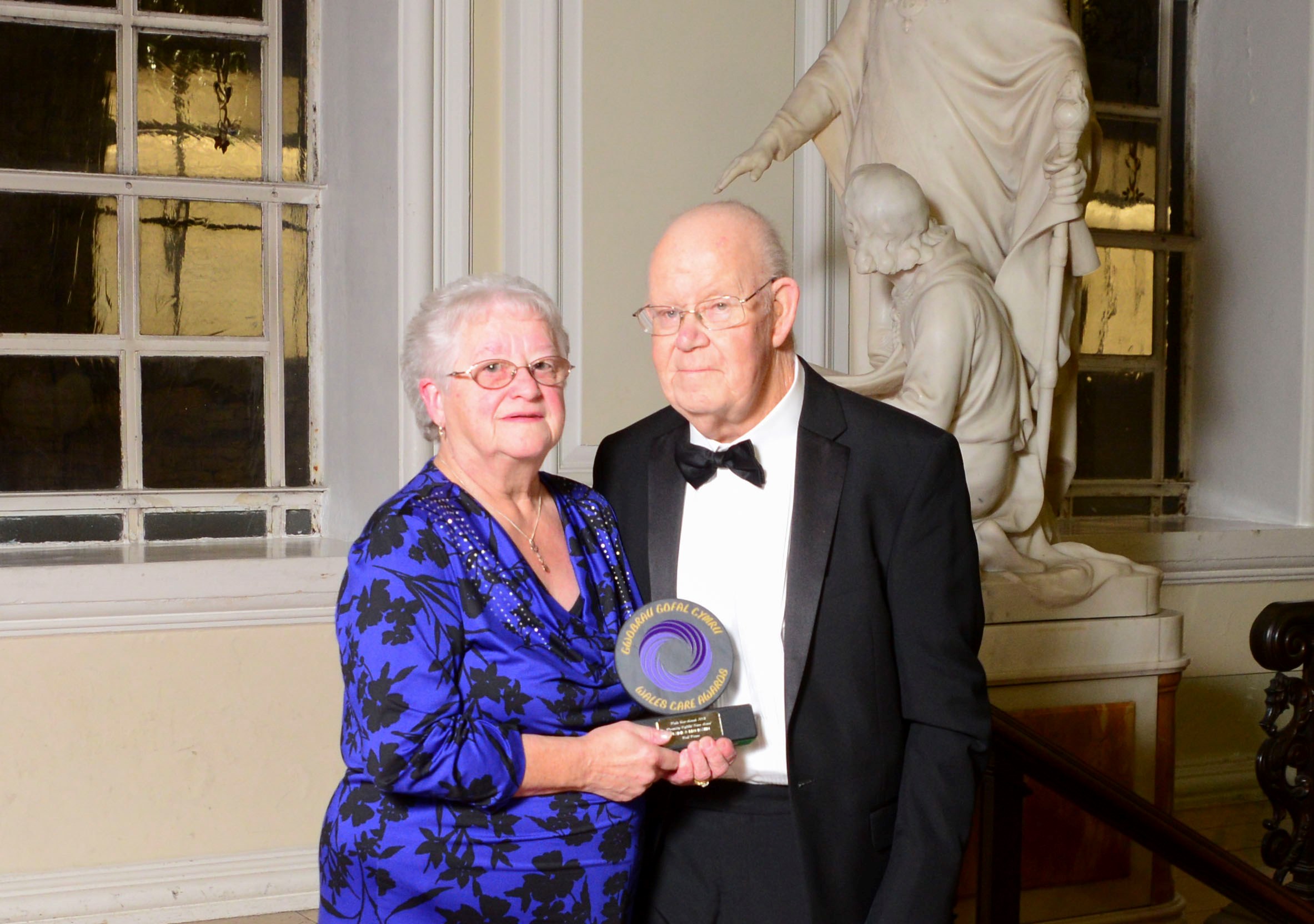 Inspiring couple who helped foster son beat the odds are honoured with top award