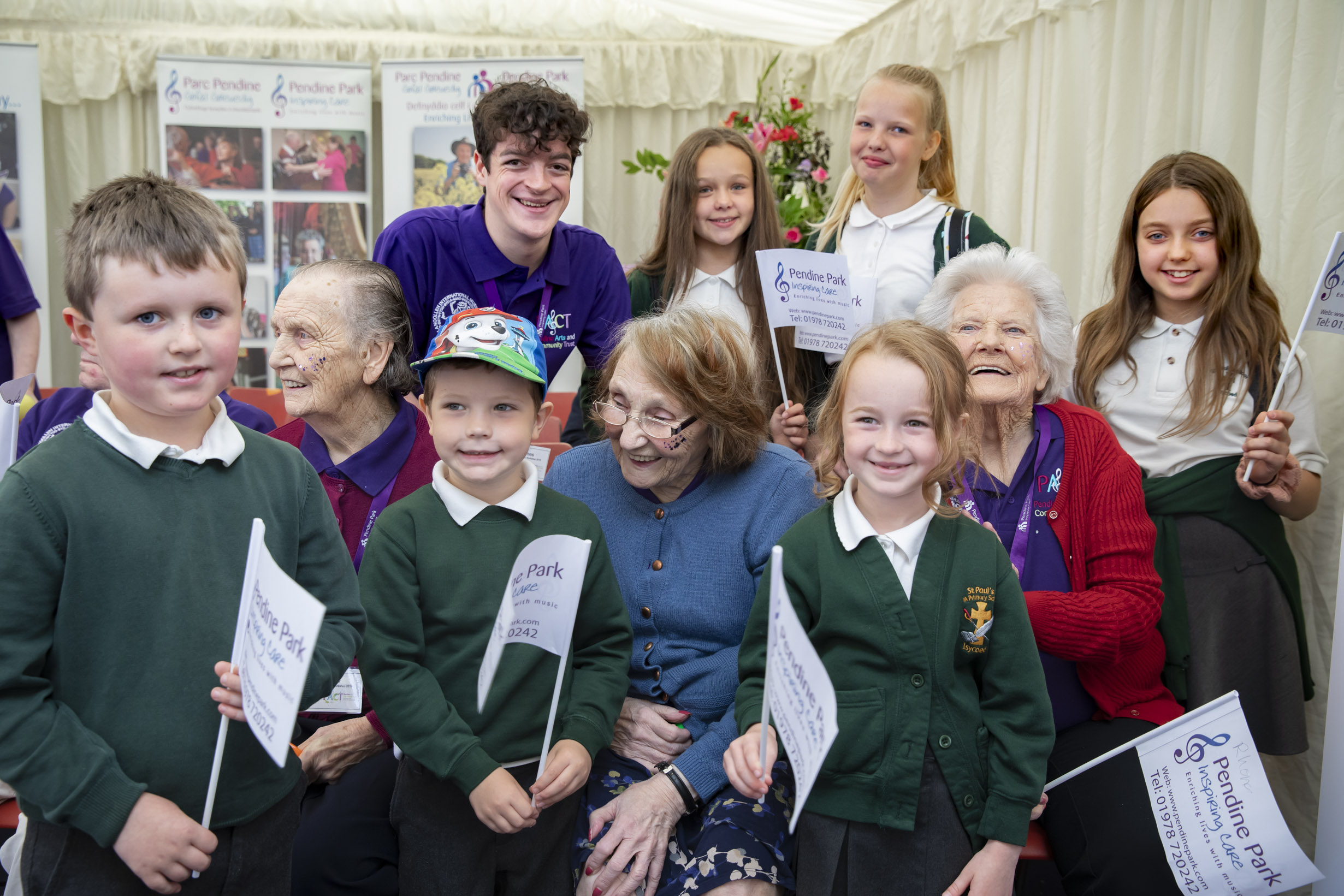 Schoolkids sing and clap along to the global beat