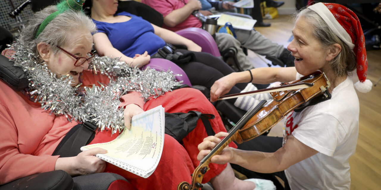 World class orchestra brings magic of Christmas to care home residents