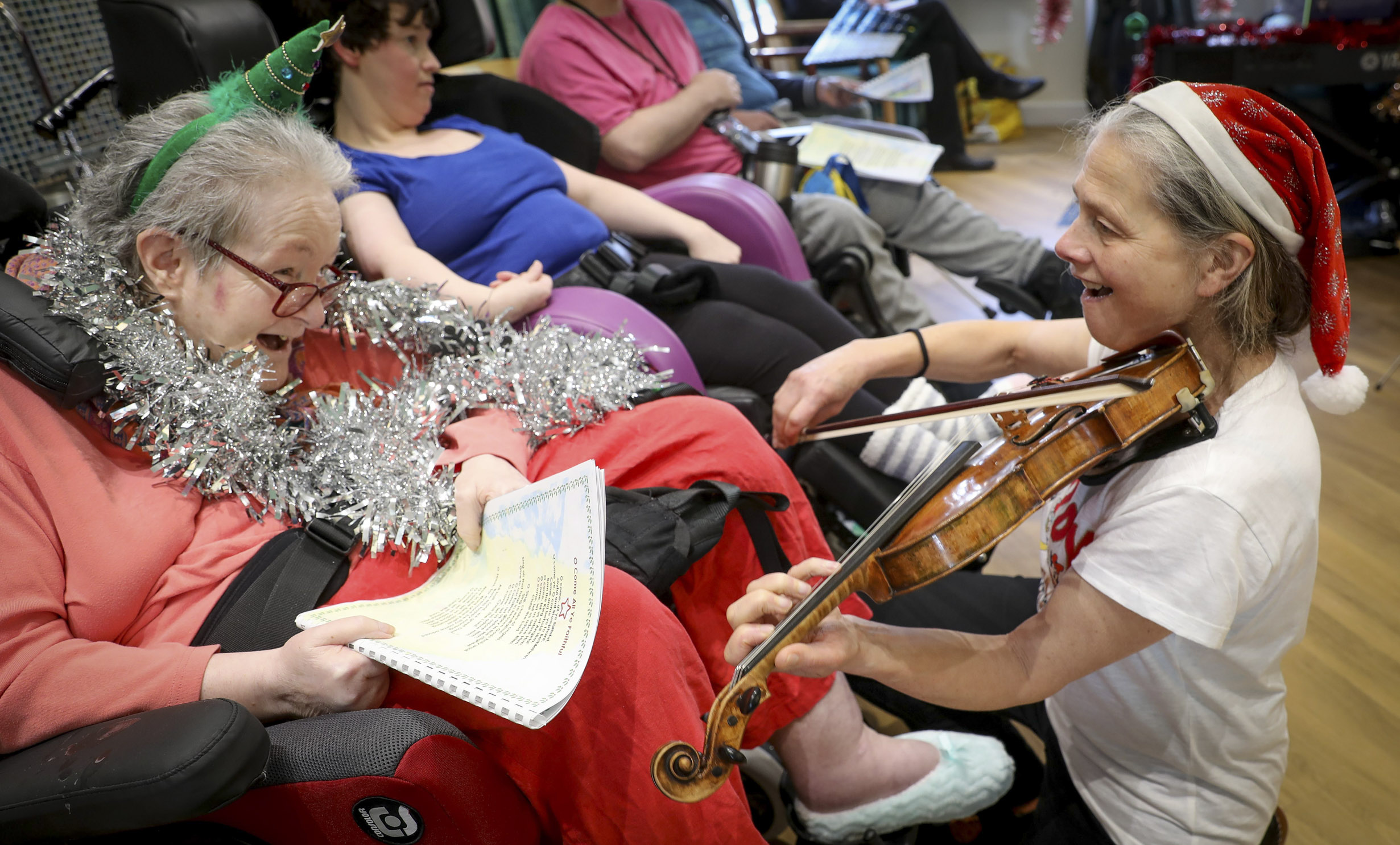World class orchestra brings magic of Christmas to care home residents