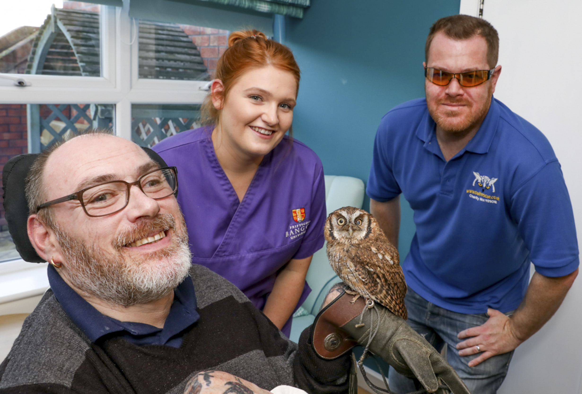 Care home residents have a hoot thanks to flying visit by rescued owls Aqua and Cheeky Chops