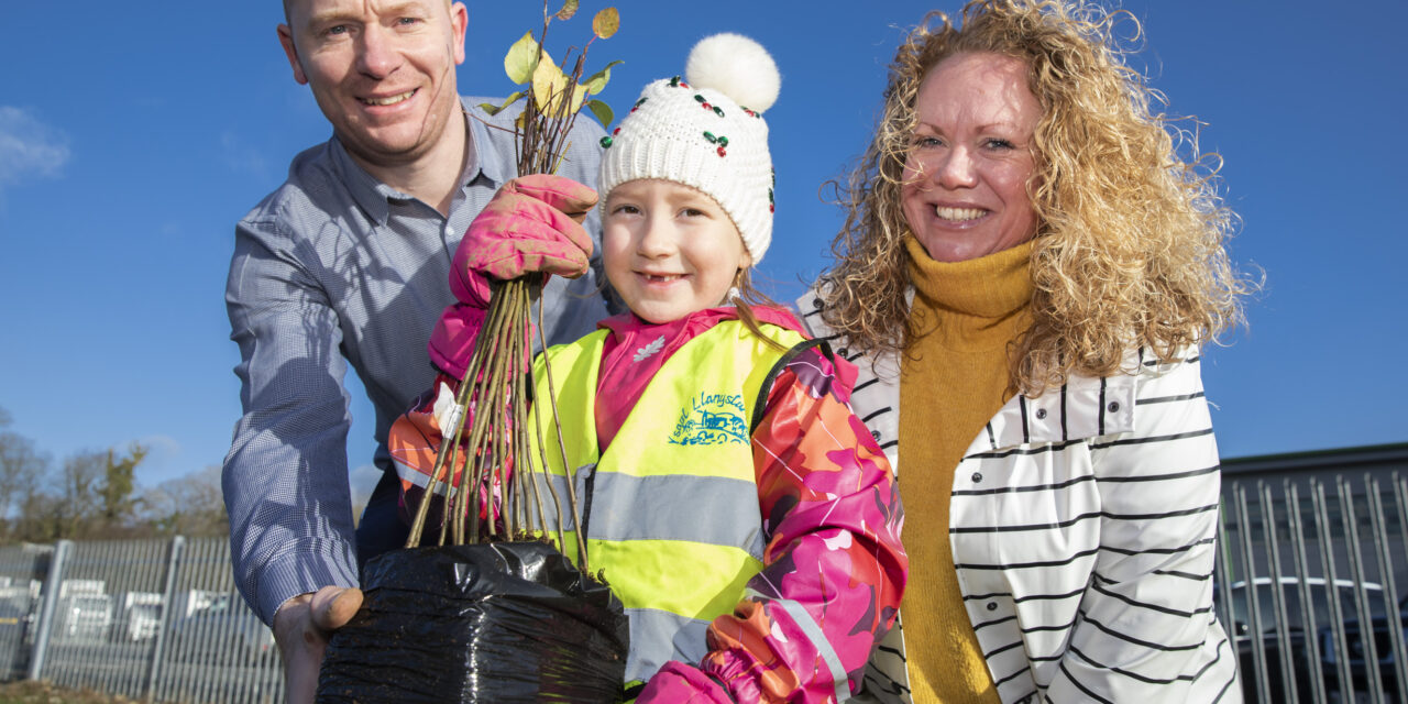Green-fingered schoolchildren help food distribution firm plant more than 500 trees