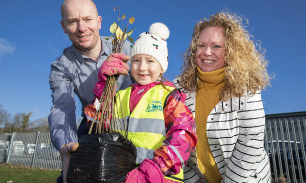 Green-fingered schoolchildren help food distribution firm plant more than 500 trees