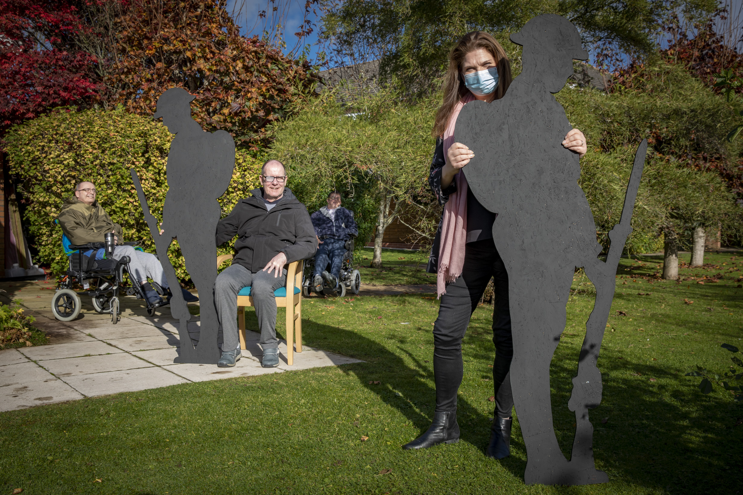 Silhouette soldiers salute care home heroes in poignant Poppy Day tribute