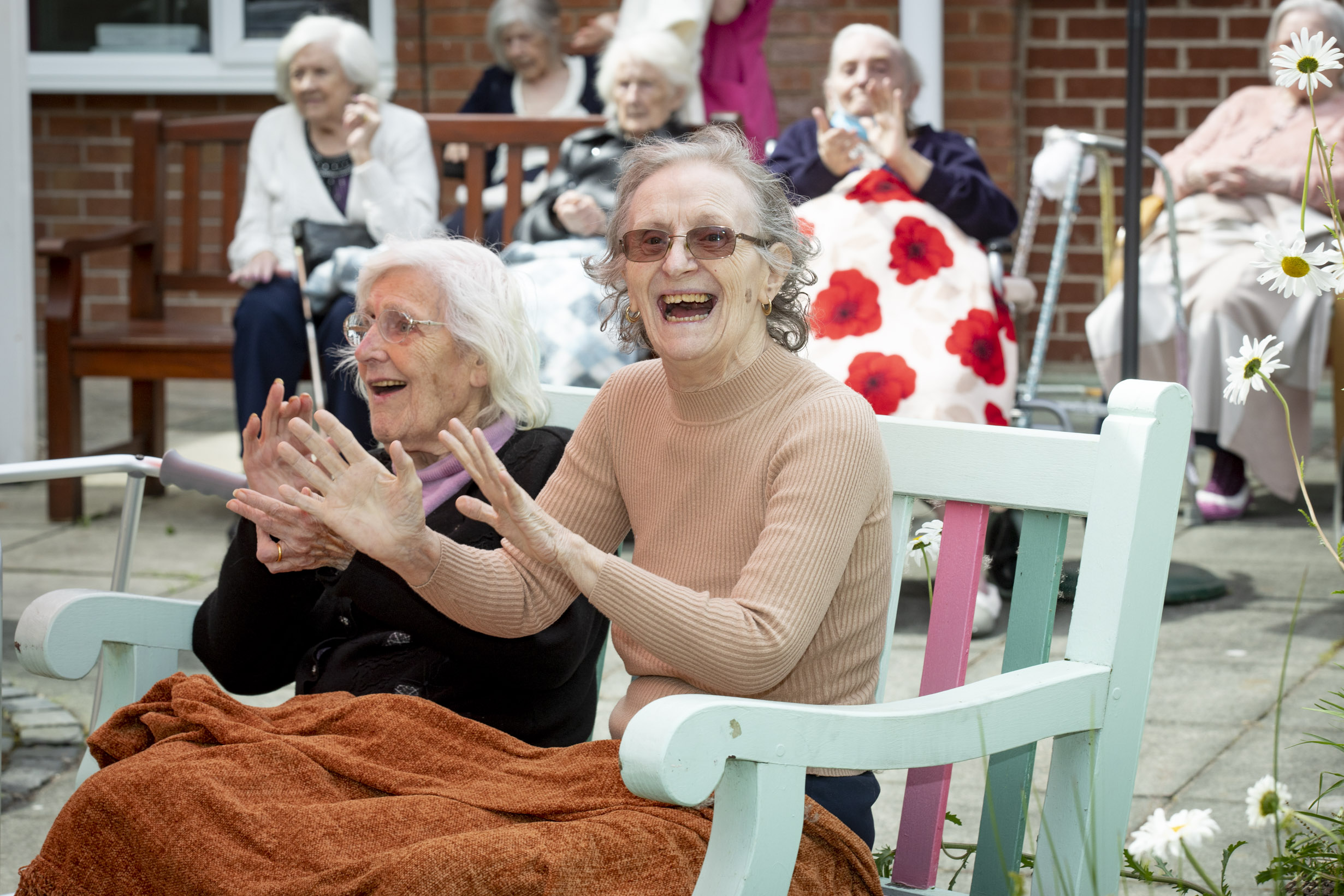 Care home residents sing and dance as they savour musical fun in the sun
