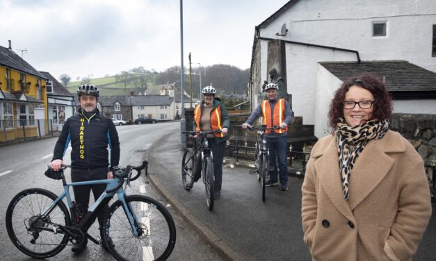 Llansannan electric bikers urging others to cash in on wind farm cash