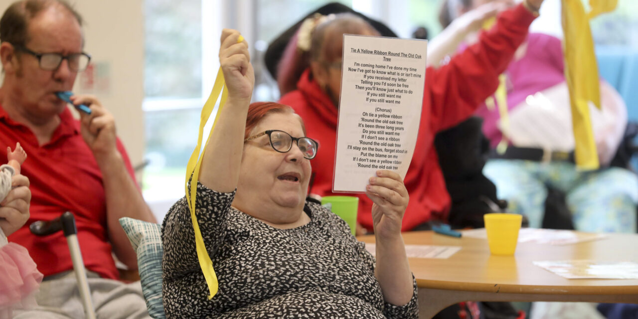 Care home residents in full voice as they sing to keep fit