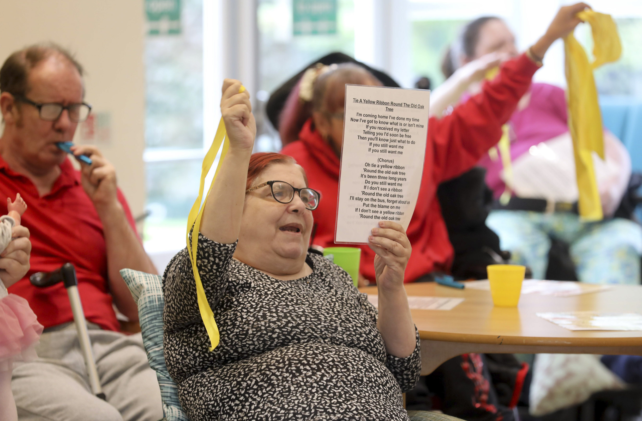 Care home residents in full voice as they sing to keep fit