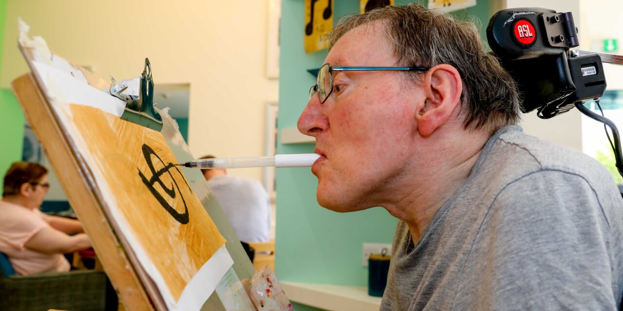 Artist Steve helps create festival’s 50th anniversary bunting using his mouth