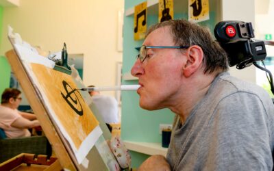 Artist Steve helps create festival’s 50th anniversary bunting using his mouth