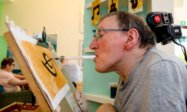 Artist Steve helps create festival’s 50th anniversary bunting using his mouth