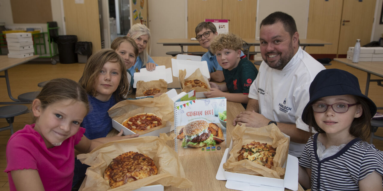 Rhos youngsters get expert guidance on pizza-making from chef Steve