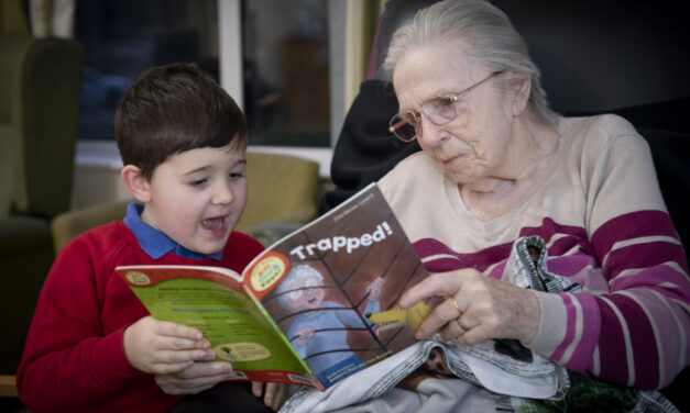 Book-loving schoolboy Harri, five, is ray of sunshine at care home where he reads adventure stories to the residents