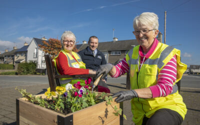 Volunteers use flower power to make village blooming beautiful