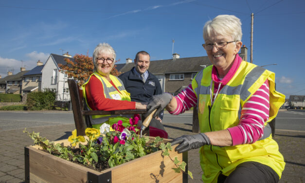 Volunteers use flower power to make village blooming beautiful