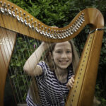 Young harpist stars as new music cooperative celebrates landmark first year in Conwy